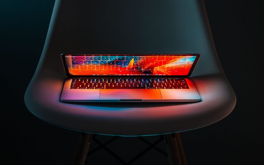 A laptop lit up with multiple colors A laptop lit up with multiple colors