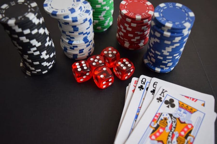 Cards, chips and dice at casino table