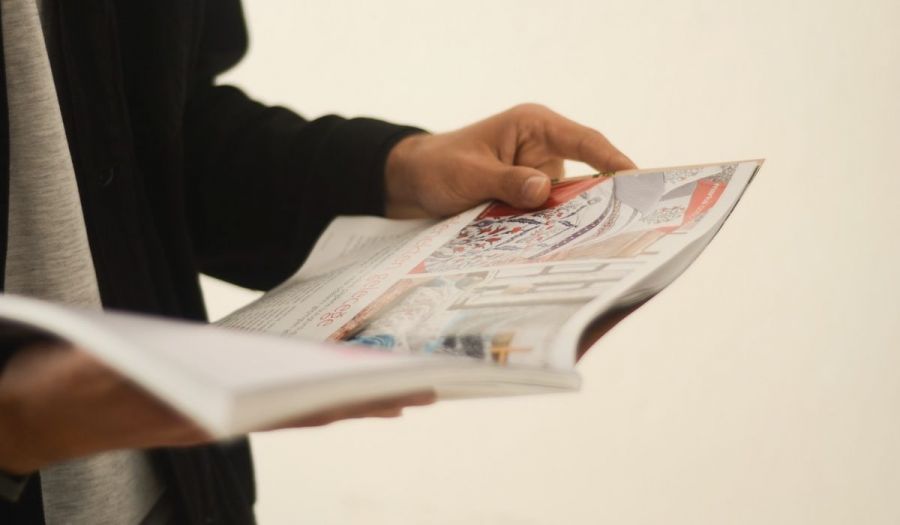 man reading a magazine