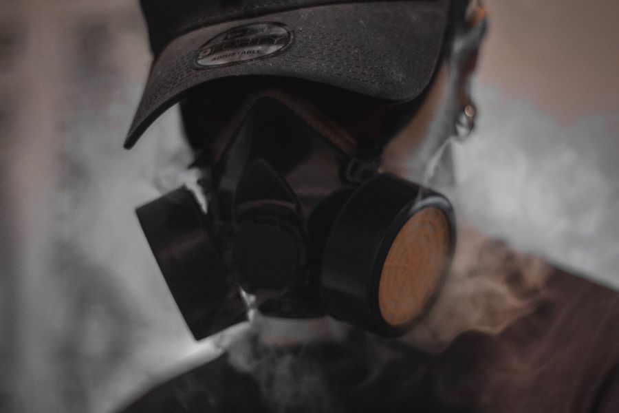 man wearing respirator to reduce chemical inhalation