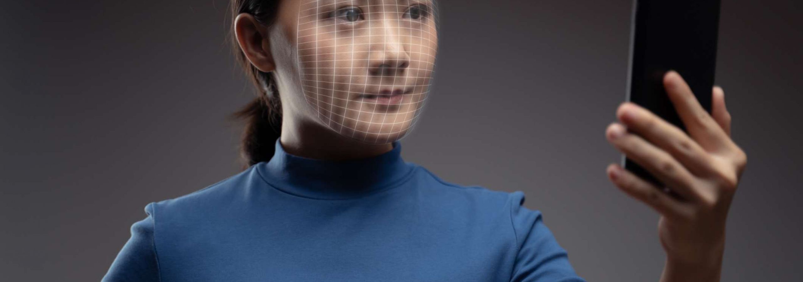Facial scan of young woman, representing how a right of publicity lawyer stops misuse of identity.