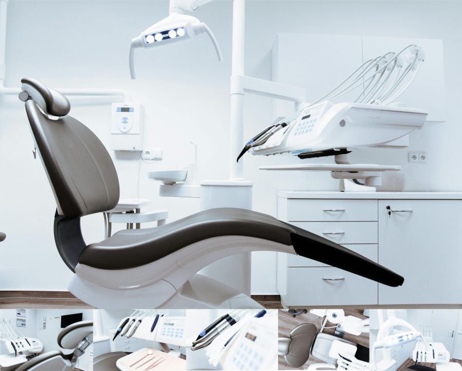 A dentist's office with the chair and other dentist equipment
