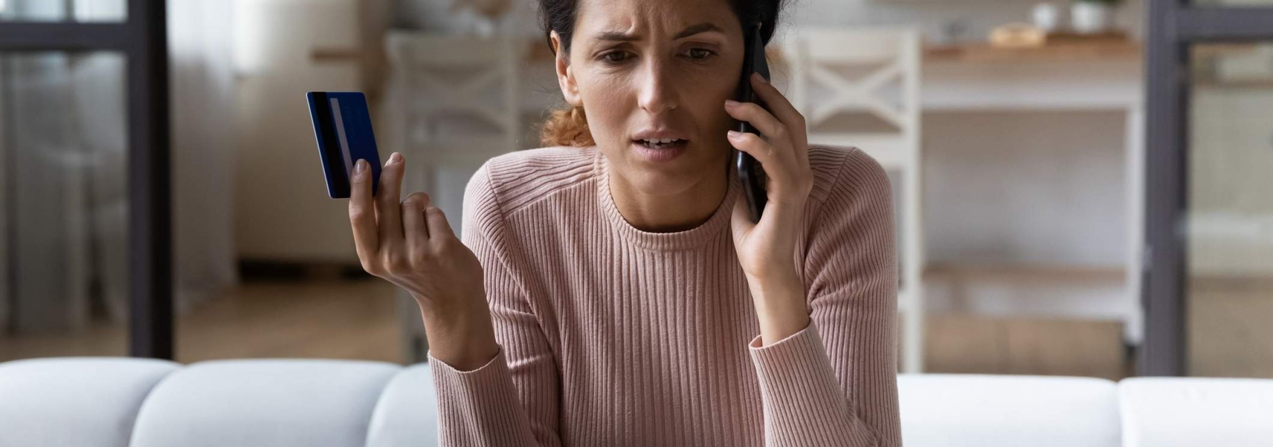 A woman discovers fraudulent activity on her credit card. She calls a data breach attorney.