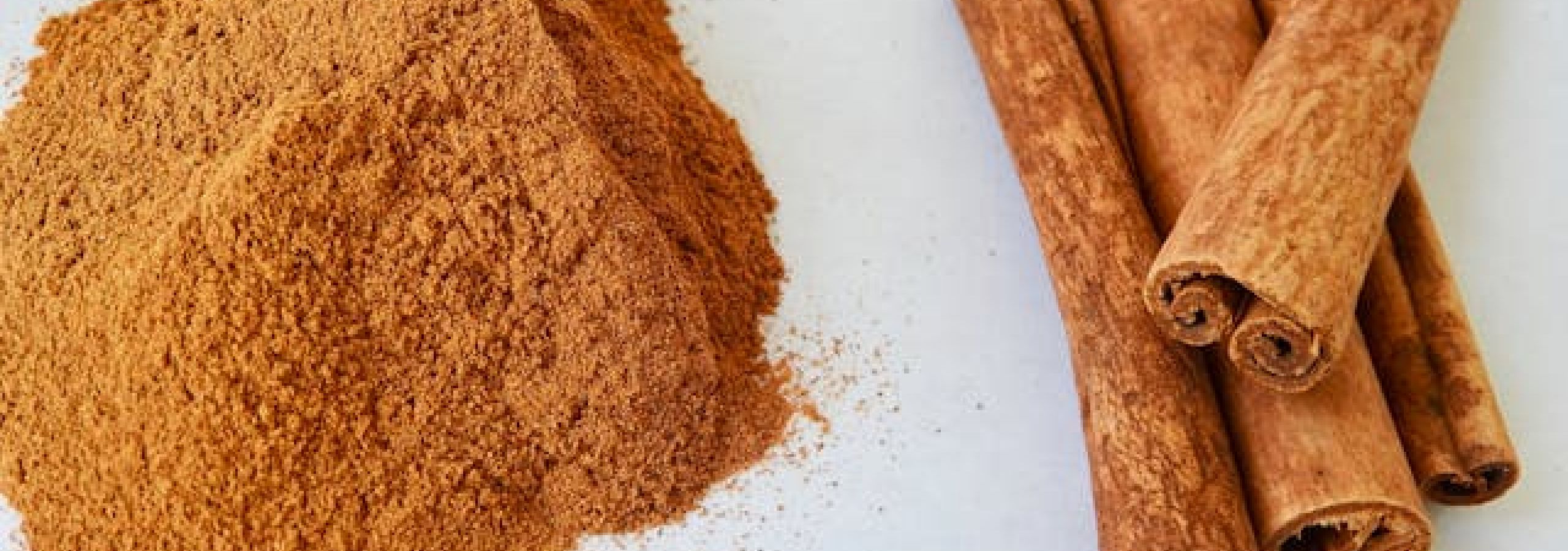 photo of cinnamon powder and sticks