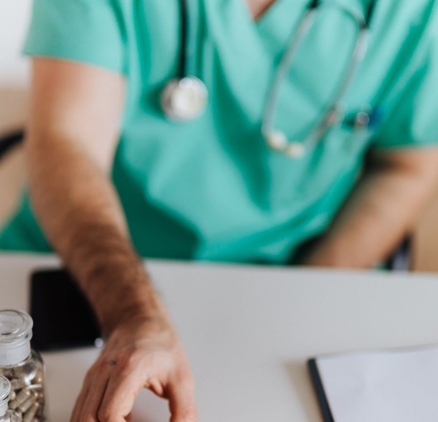 medical professional at desk