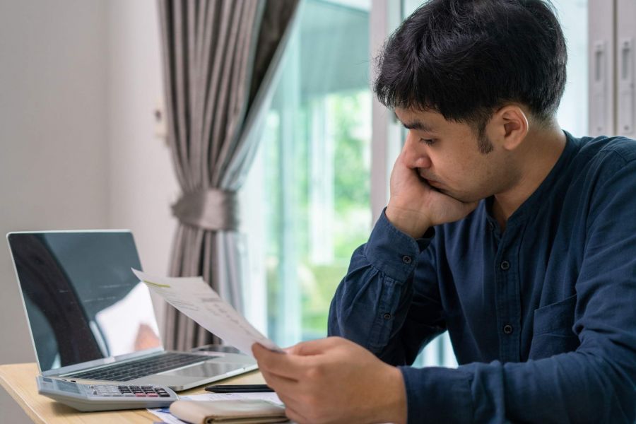 A man discovering hidden fees on his cable bill.