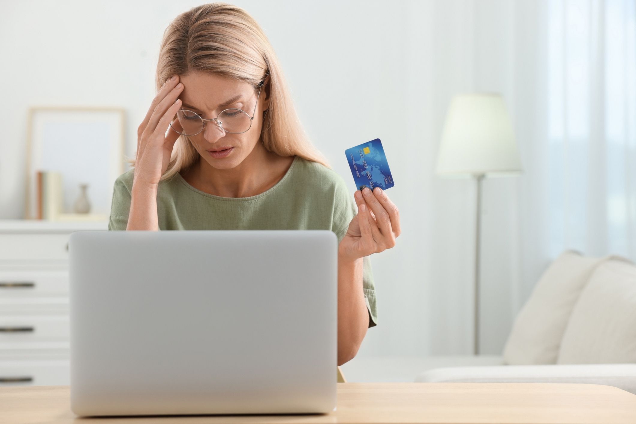 A woman discovers fraudulent credit card activity, realizing she may be a victim of tax refund fraud.