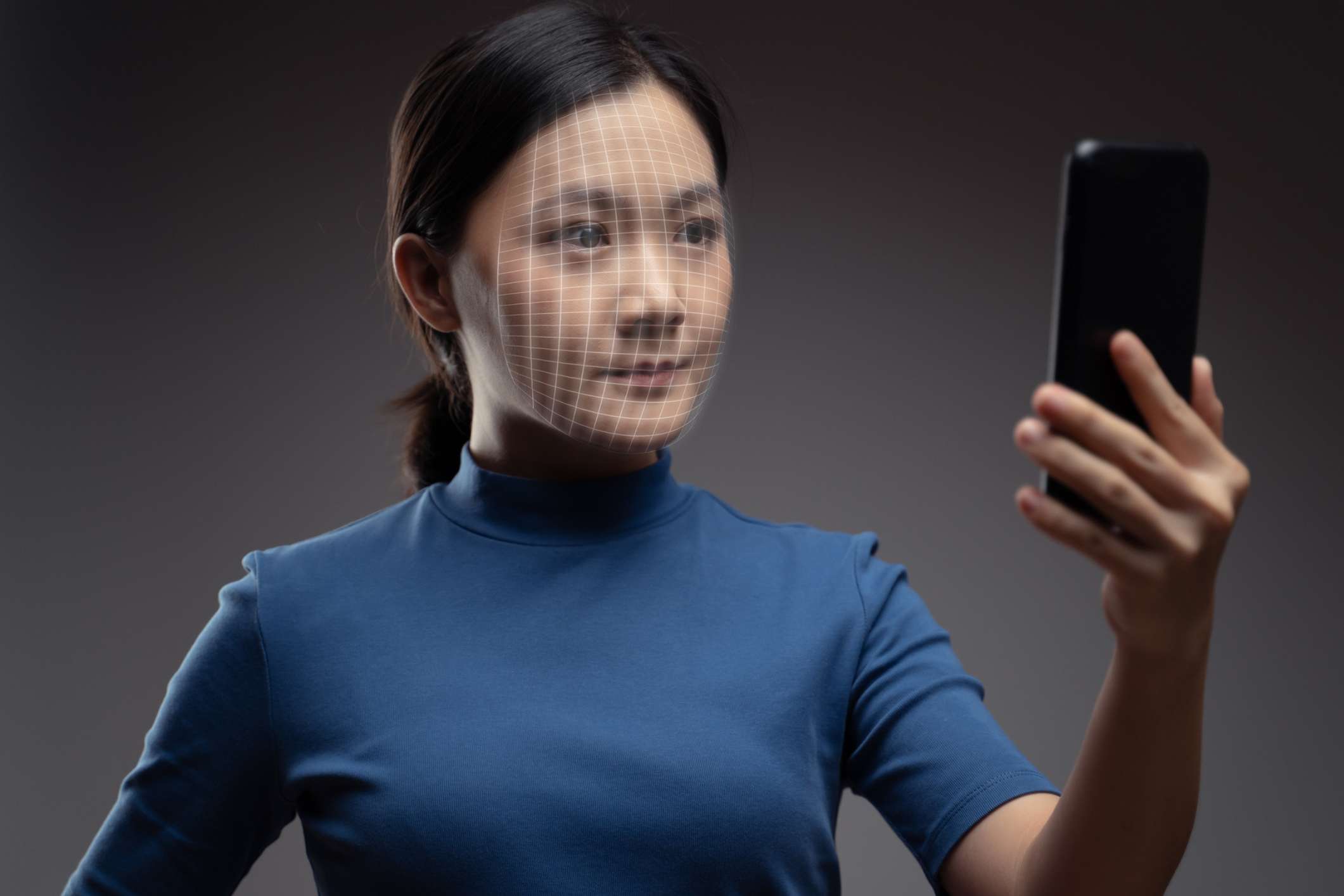 Facial recognition system scans woman’s face. A right of publicity lawyer can stop unauthorized use.