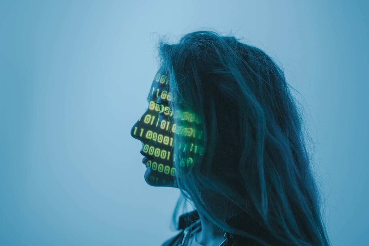 a graphic of a woman with ones and zeros on her profile, symbolizing her biometrics in an instance of AI genetic capture