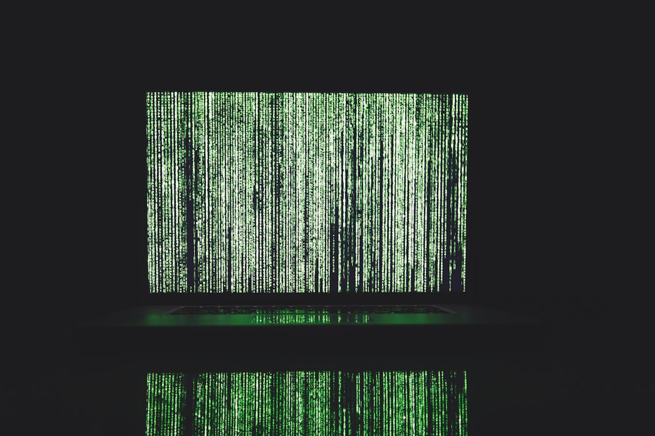 Binary code on a computer in green font